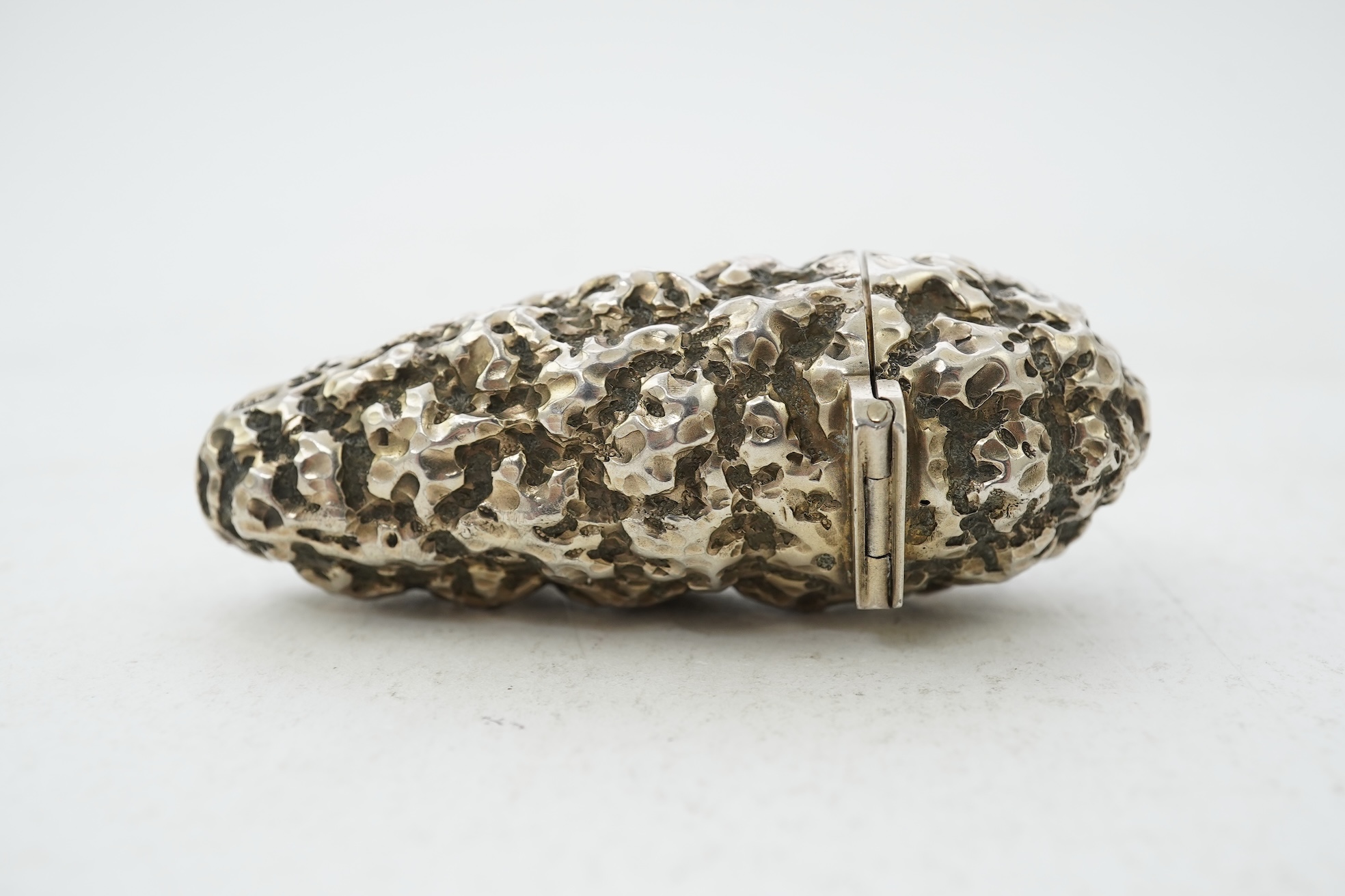 A late Victorian novelty silver scent flask, modelled as a 'gold nugget' by George Ward